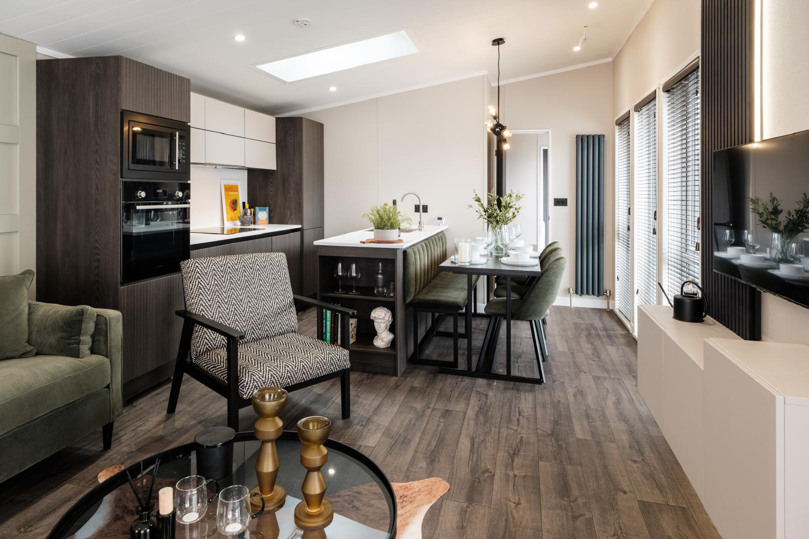 Open-plan living space with dining table and lounge area.